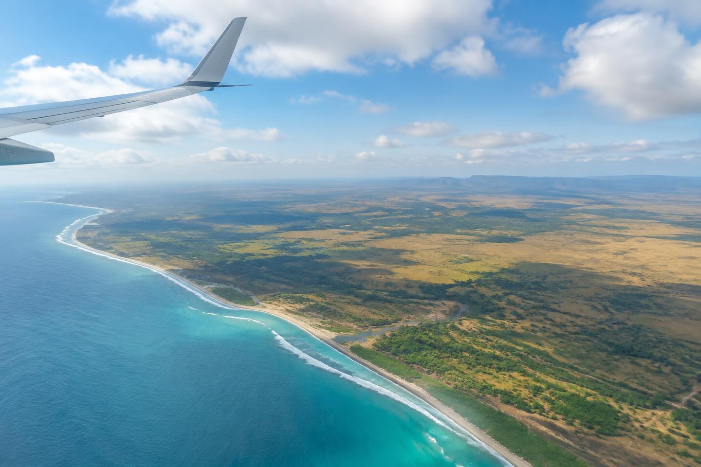 Aircraft wing above the African coastline